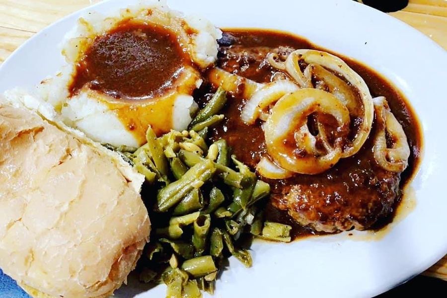 Hamburger steak with gravy, mashed potatoes and green beans